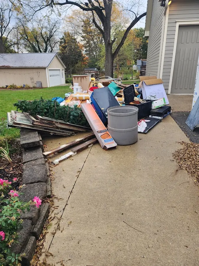 Dumpster being loaded with debris for 30 Yard Dumpster Rental in Saltillo